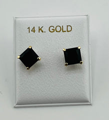 Baby earing black stone