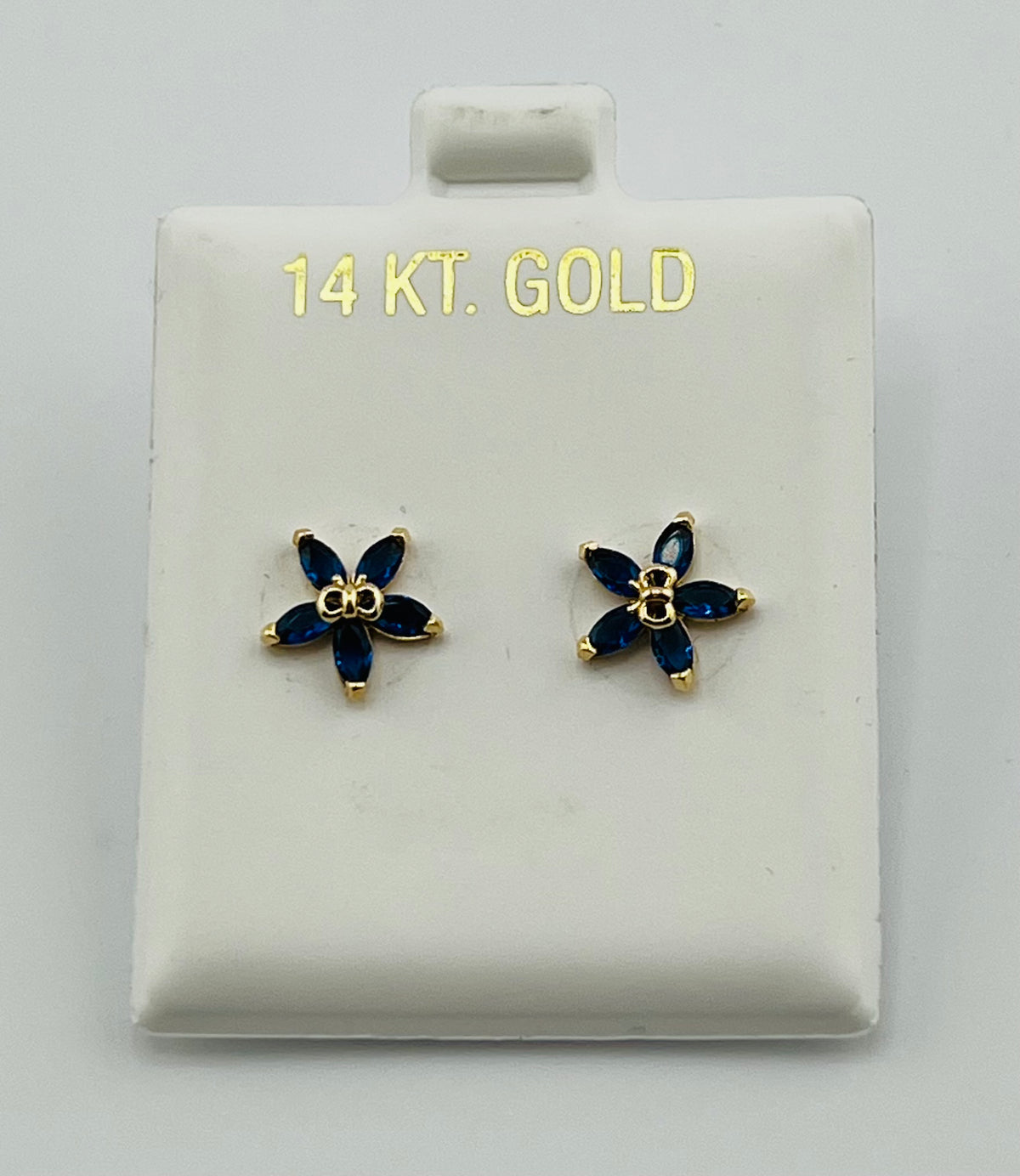 Baby earing blue flower