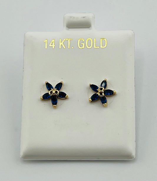 Baby earing blue flower