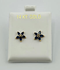 Baby earing blue flower