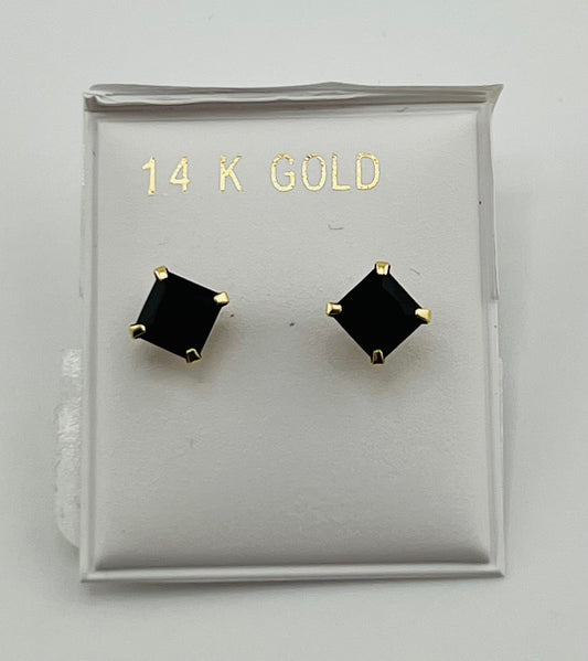 Baby earing small black stone