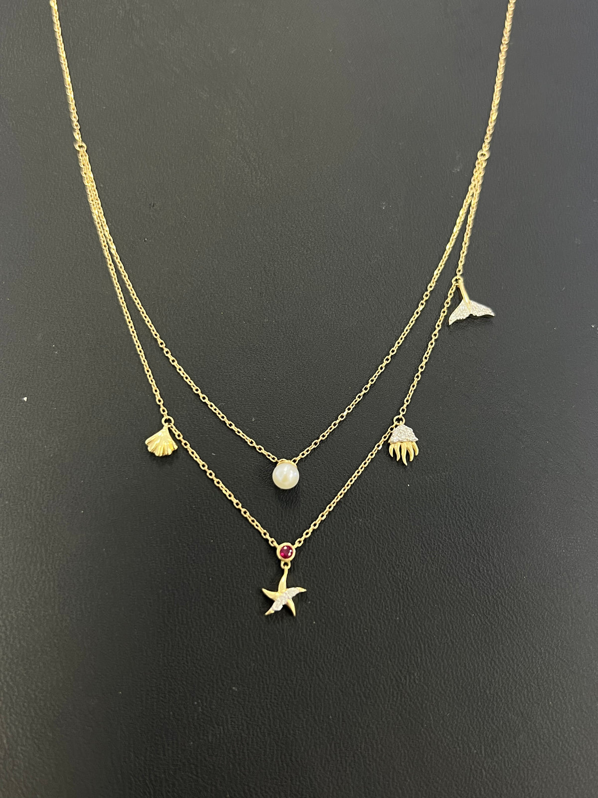 14k gold beach necklace with .16ct diamond