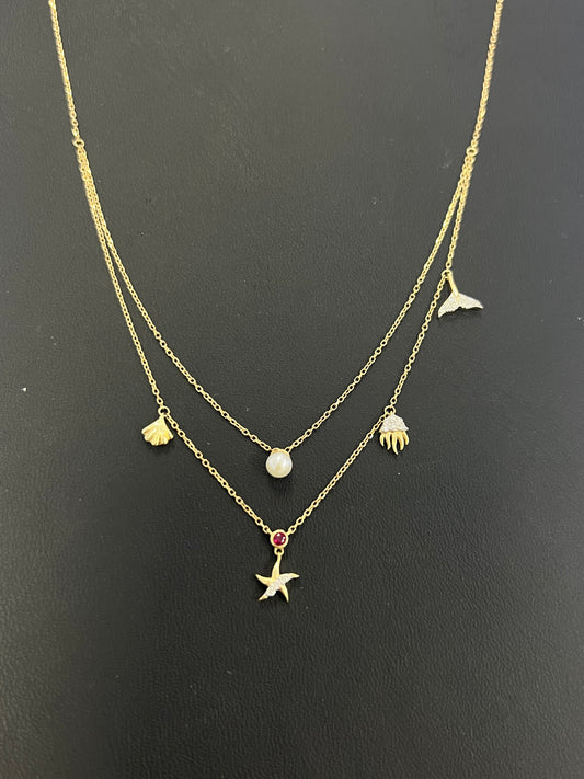 14k gold beach necklace with .16ct diamond