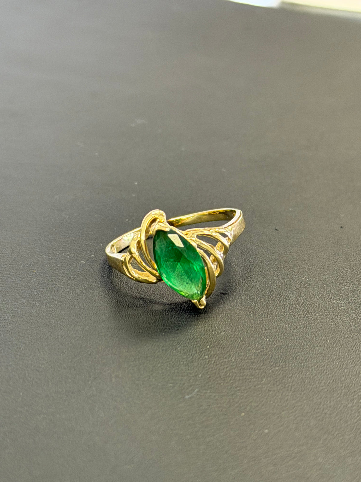 14k green emerald marquise shaped stone