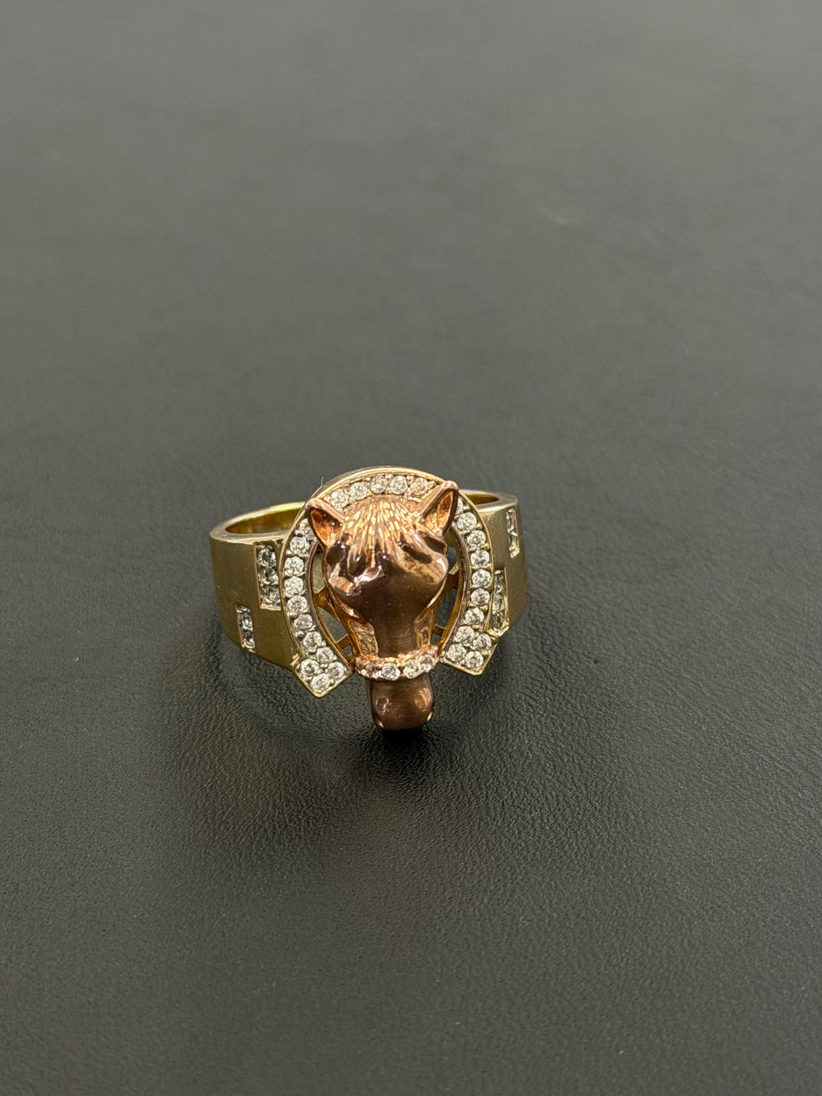 14k horseshoe with stones gold and rose gold